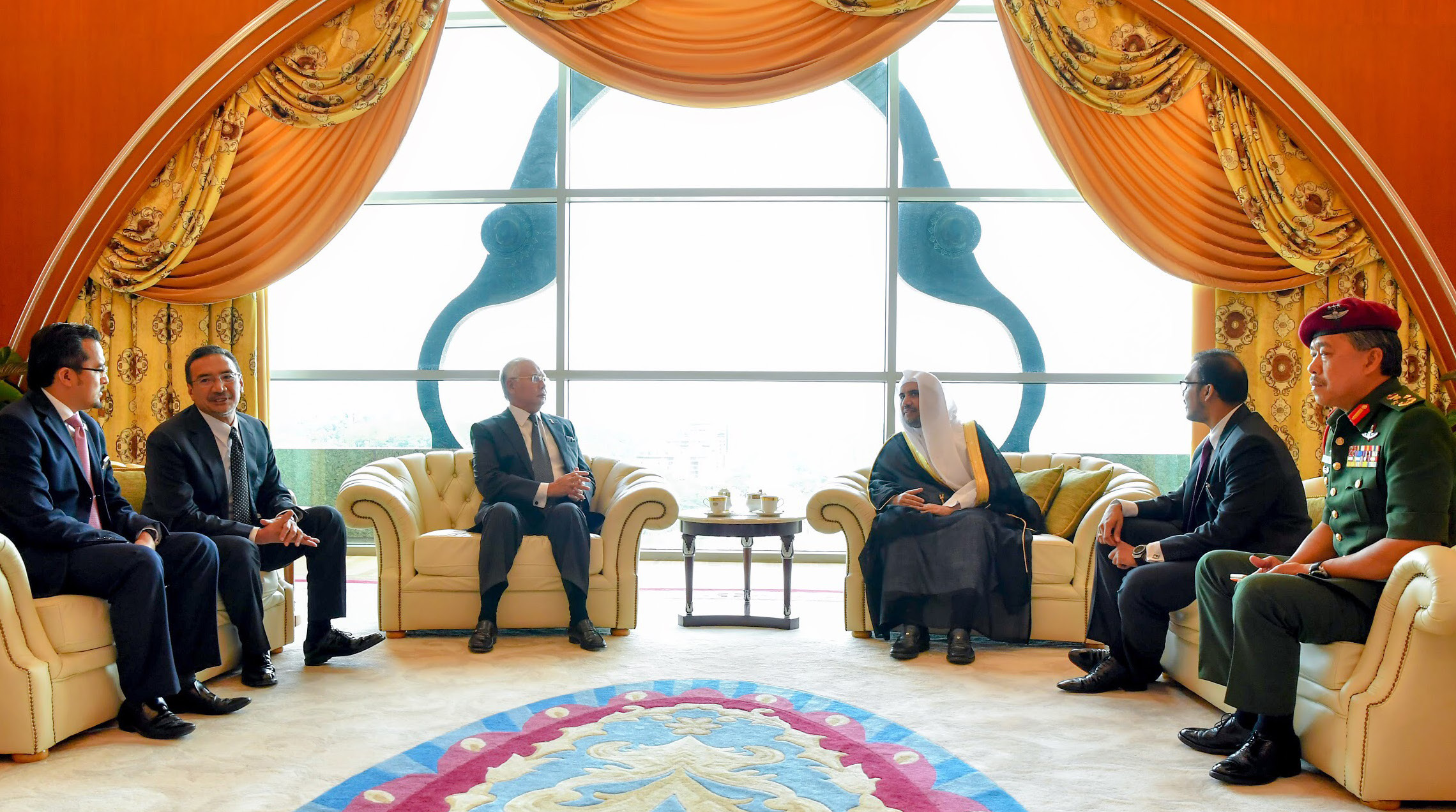 His Excellency the Prime Minister of Malaysia Mr. Najib Abdul Razak welcomes His Excellency Sheikh Dr. Mohammed bin Abdul Karim Al-Issa at the Office of the Prime Minister in the capital of Kuala Lumpur, along with several other Malaysian ministers