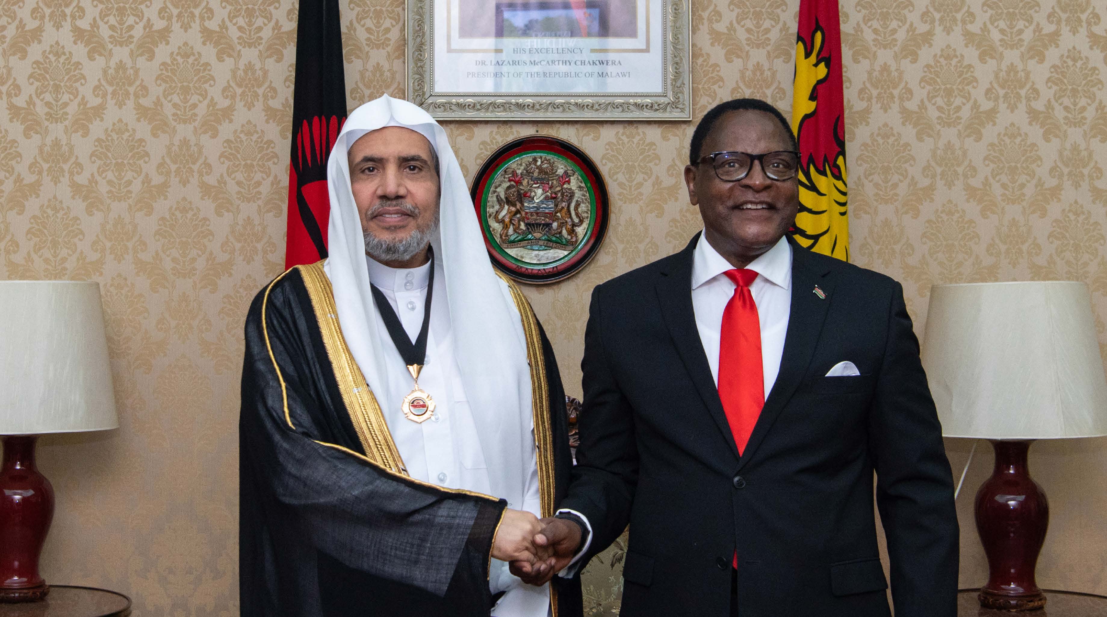 His Excellency the President of the Republic of Malawi, Mr. Lazarus McCarthy Chakwera, awards His Excellency Sheikh Dr. Mohammed bin Abdul Karim Al-Issa the Republic Medal in reorganization of the humanitarian efforts undertaken by Dr. Al-Issa